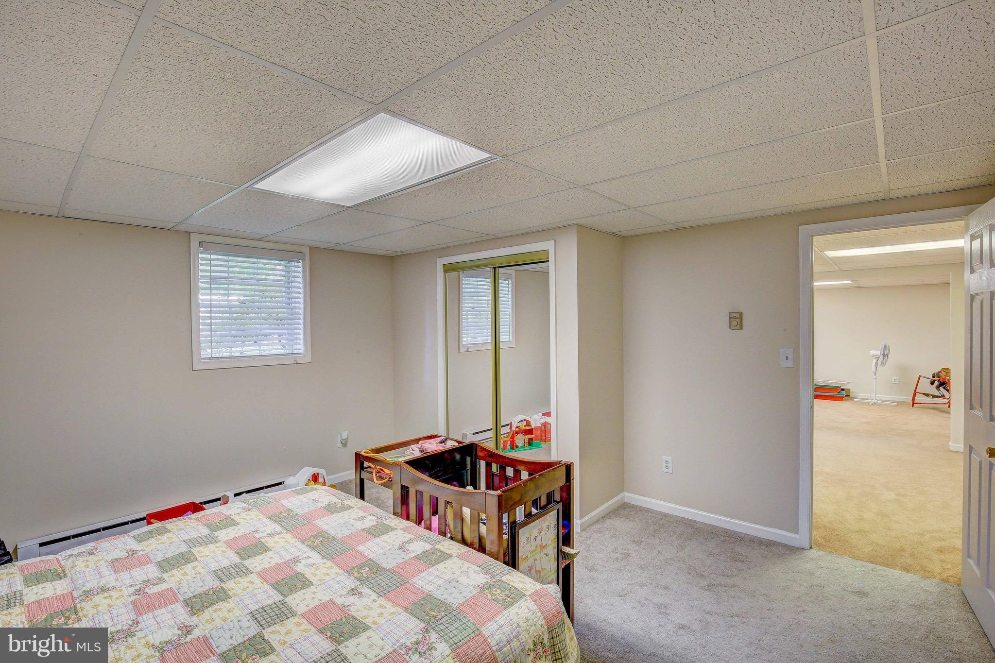 147 Calvert Towne Road Prince Frederick, MD 20678 - Photo 24 of 30 a bedroom with furniture and window