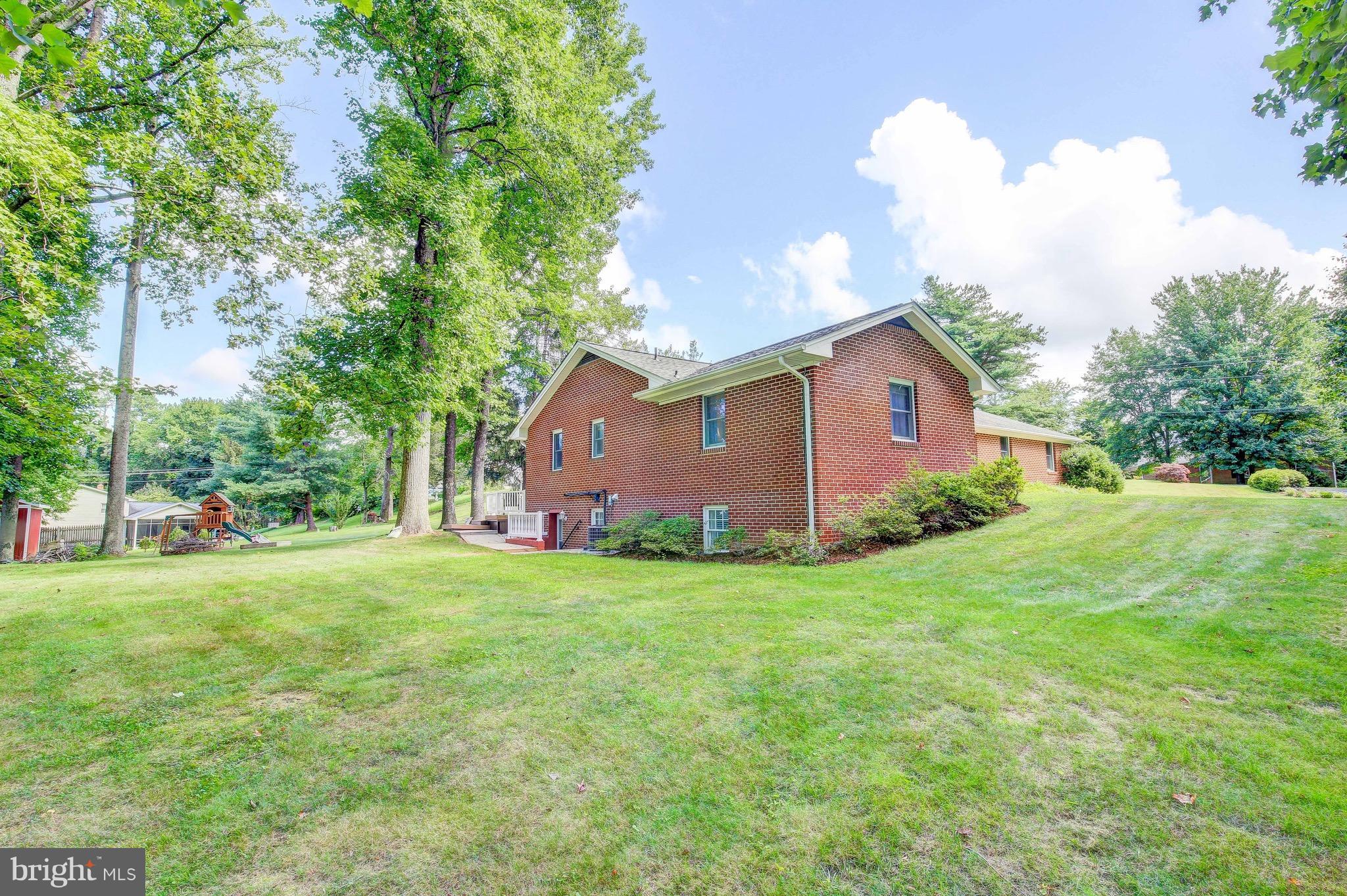 147 Calvert Towne Road Prince Frederick, MD 20678 - Photo 25 of 30 a front view of a house with garden