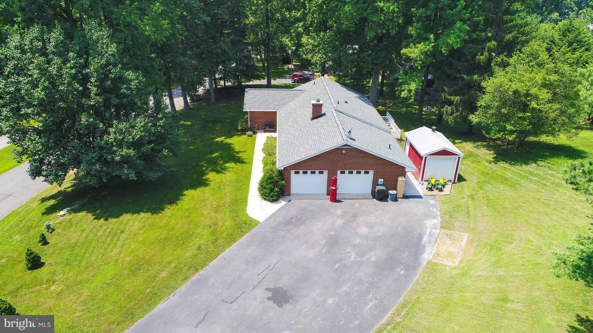 147 Calvert Towne Road Prince Frederick, MD 20678 - Photo 30 of 30 a house view with a yard and pool