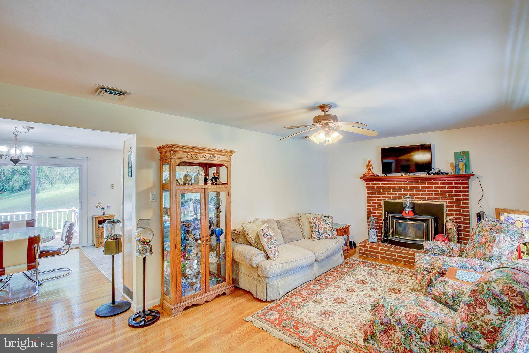 147 Calvert Towne Road Prince Frederick, MD 20678 - Photo 5 of 30 a living room with furniture and a fireplace