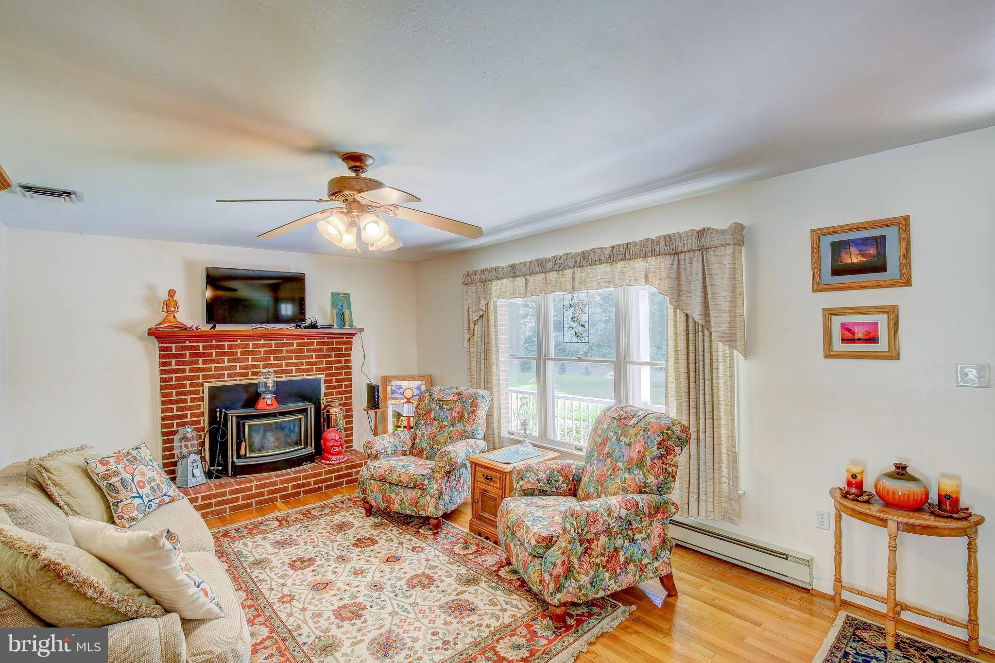 147 Calvert Towne Road Prince Frederick, MD 20678 - Photo 7 of 30 a living room with furniture fireplace and flat screen tv