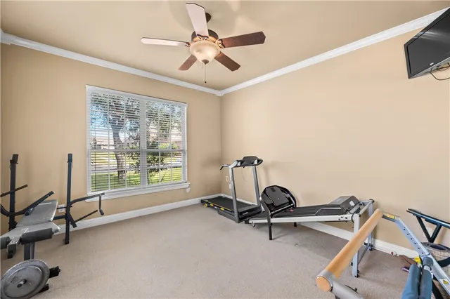 a room with gym equipment and a large window
