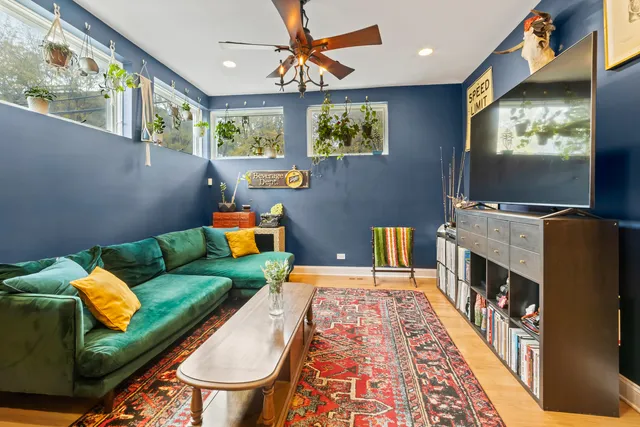 a bedroom with furniture and a rug