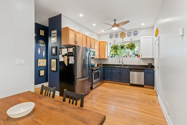 a kitchen with stainless steel appliances granite countertop a stove and a refrigerator
