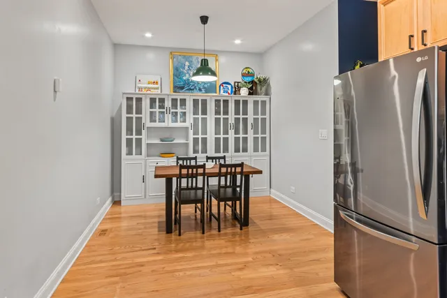 a view of a dining room with furniture and a window