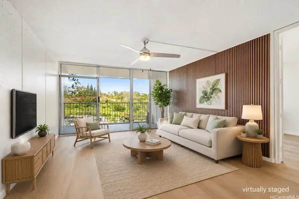 a living room with furniture and a large window