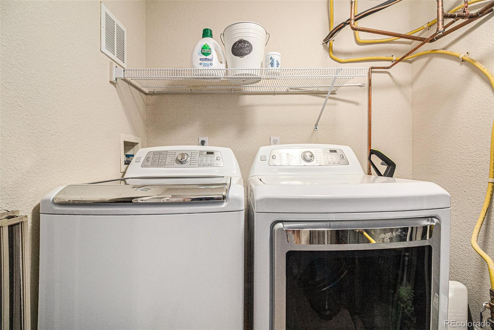1699 North Downing Street, Unit 302 Denver, CO 80218 - Photo 22 of 23 a utility room with dryer and washer