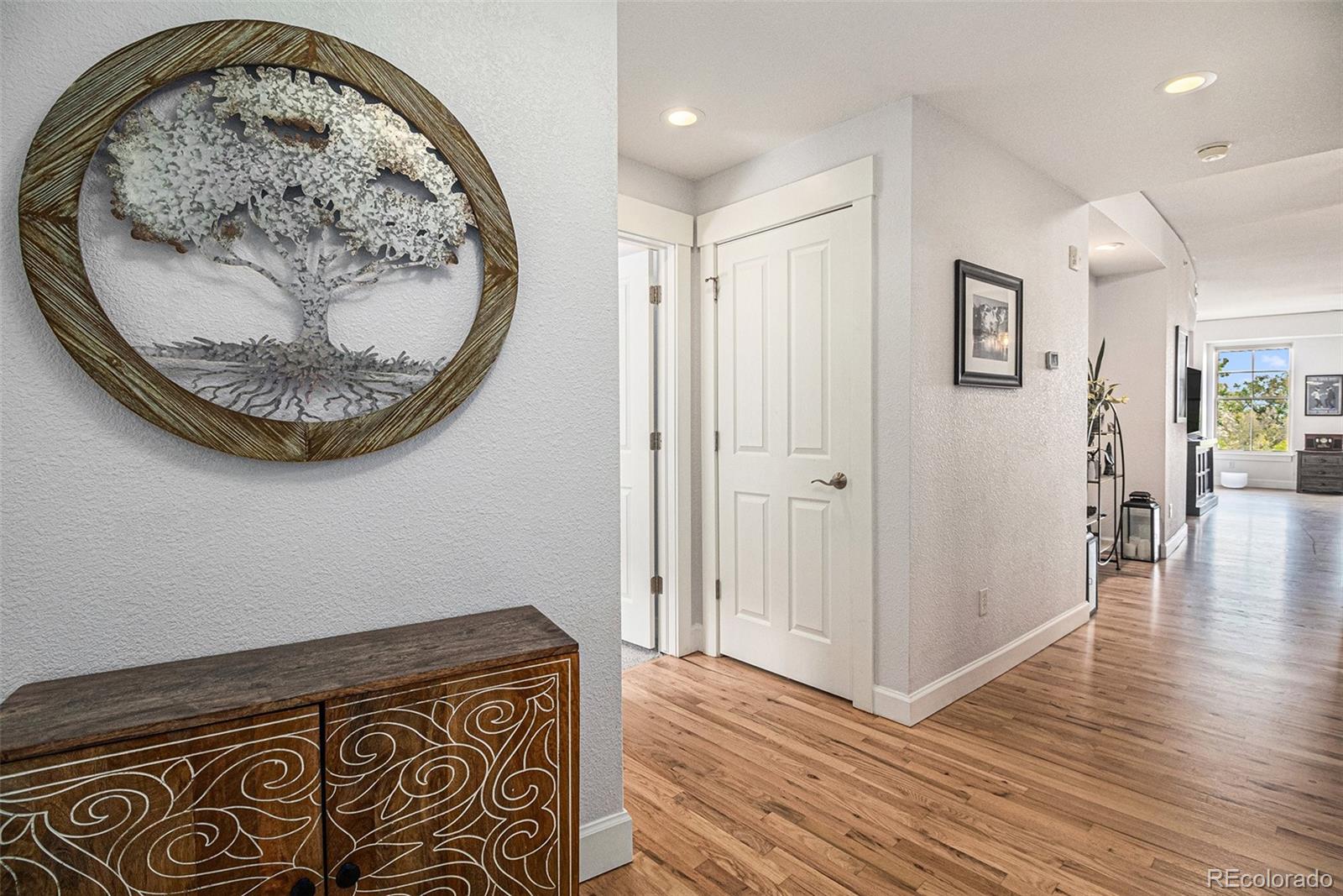 1699 North Downing Street, Unit 302 Denver, CO 80218 - Photo 5 of 23 an entryway with wooden floor and wooden floor