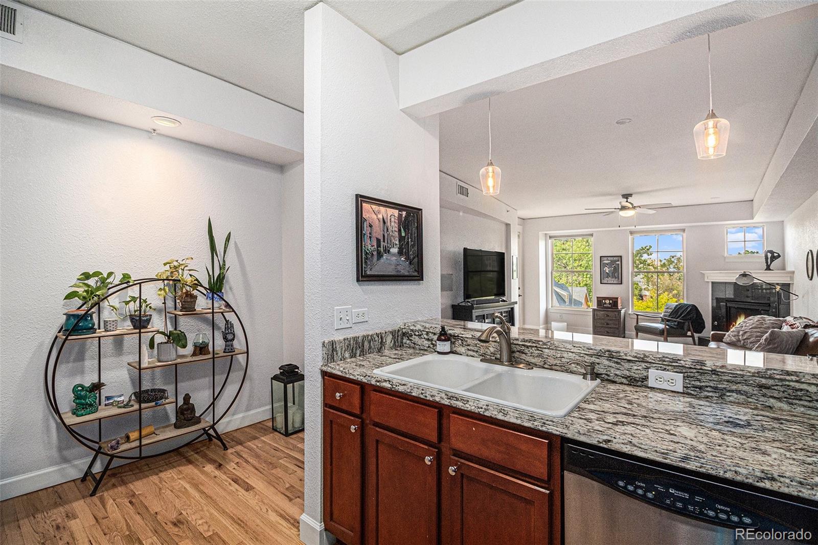 1699 North Downing Street, Unit 302 Denver, CO 80218 - Photo 7 of 23 a bathroom with double vanity sink and a mirror