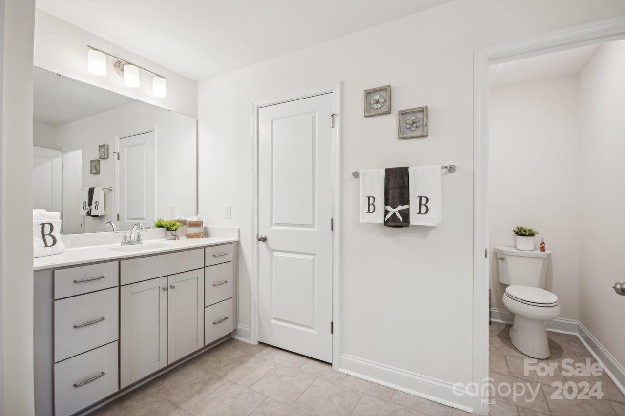 3027 Patchwork Court Fort Mill, SC 29708 - Photo 21 of 33 a bathroom with a toilet a sink and mirror