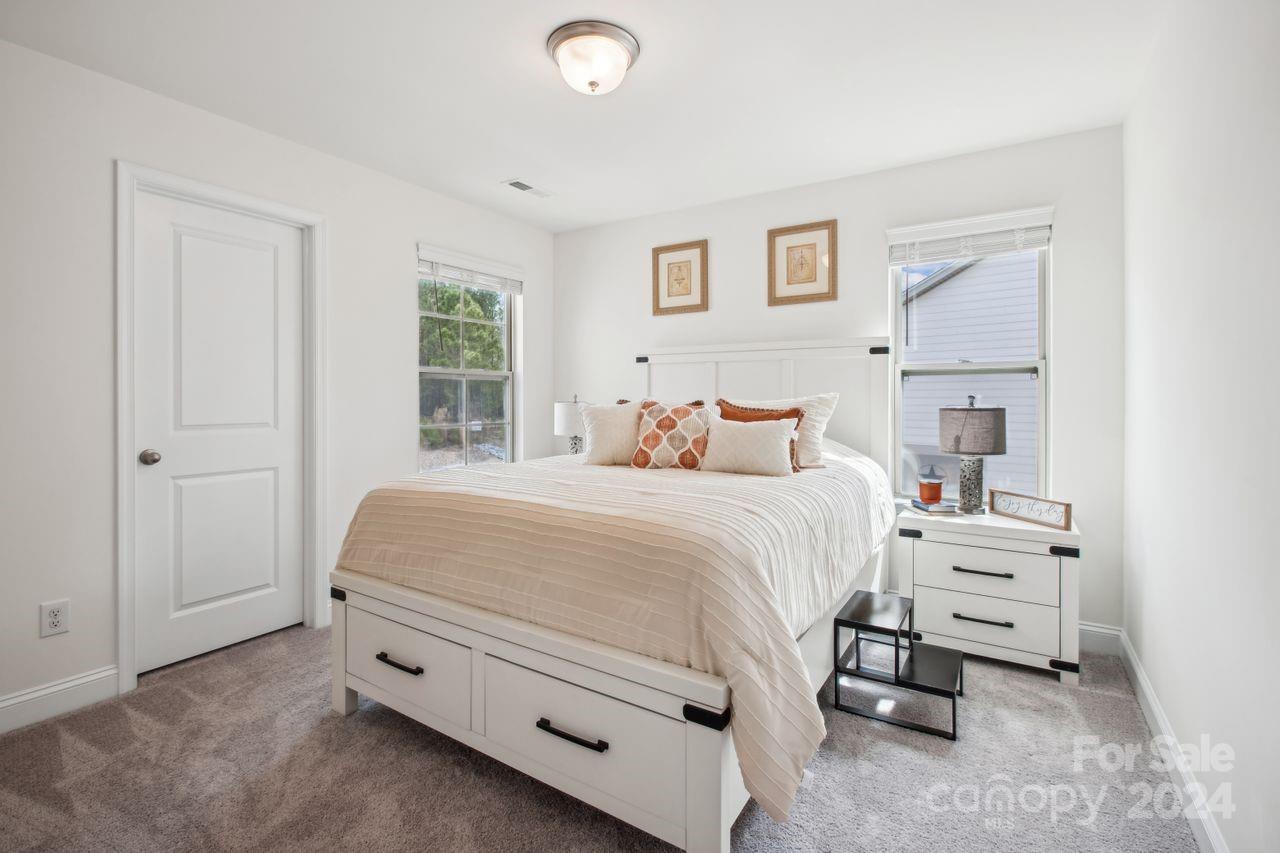 3027 Patchwork Court Fort Mill, SC 29708 - Photo 23 of 33 a bedroom with a bed and a window