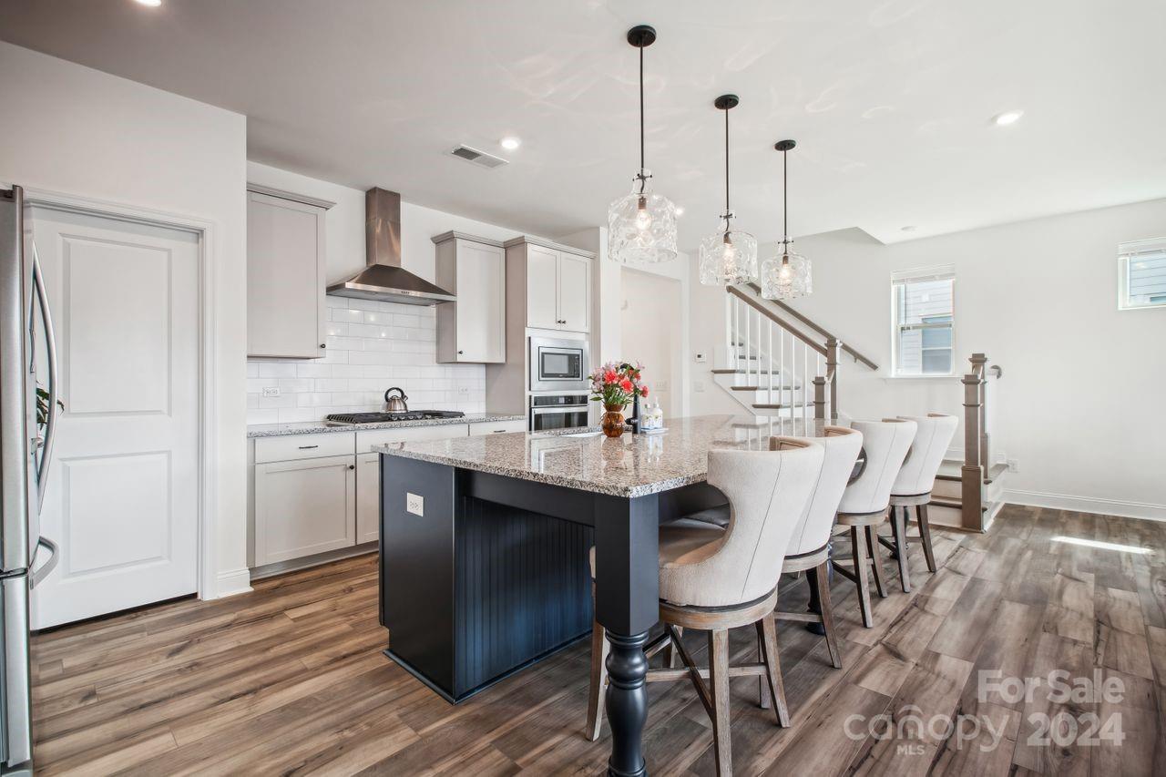 3027 Patchwork Court Fort Mill, SC 29708 - Photo 10 of 33 a view of kitchen with cabinets and wooden floor
