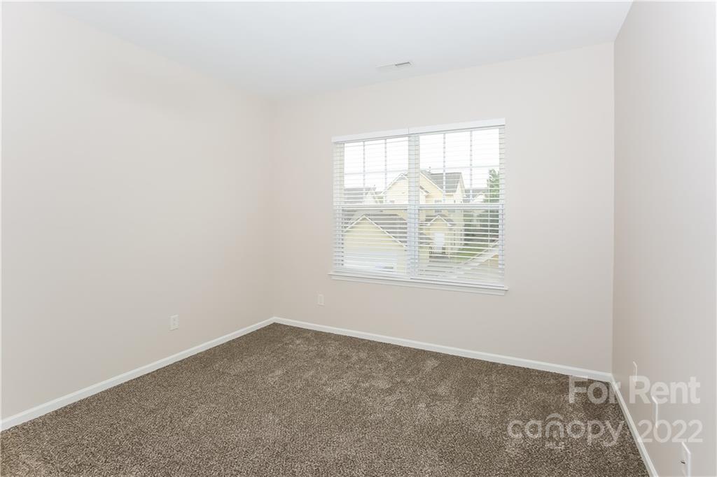 118 West Decatur Avenue Mooresville, NC 28117 - Photo 14 of 17 an empty room with windows