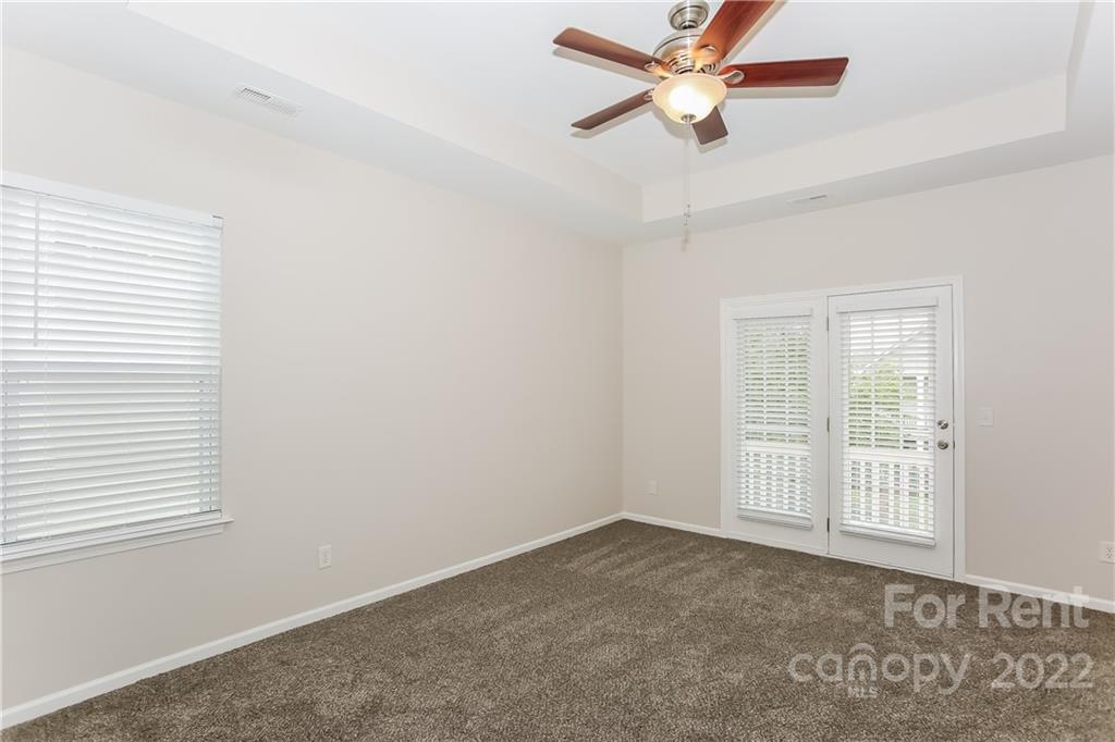 118 West Decatur Avenue Mooresville, NC 28117 - Photo 9 of 17 an empty room with windows and fan