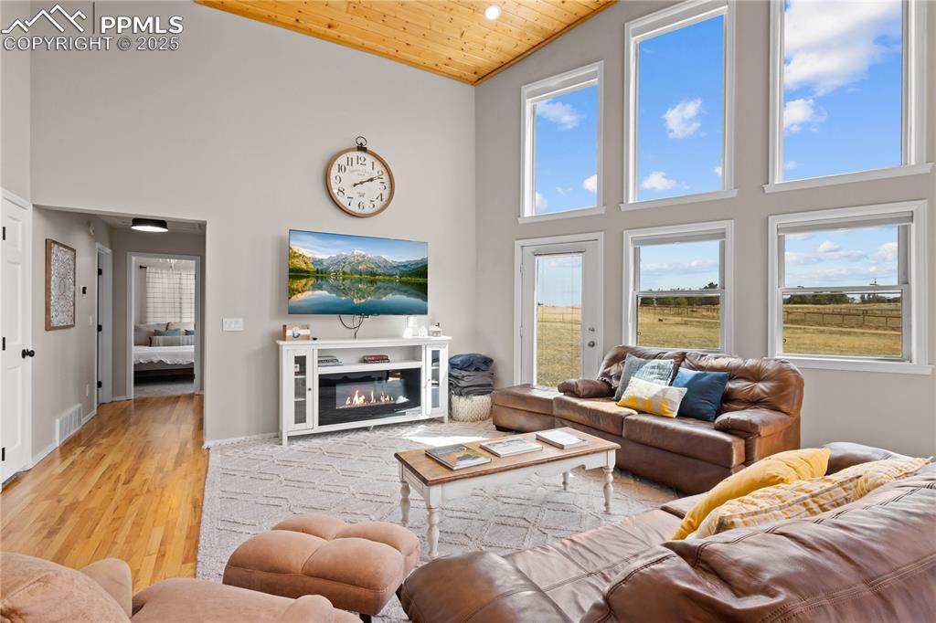 545 Struthers Loop Colorado Springs, CO 80921 - Photo 14 of 48 a living room with furniture large window and flat screen tv