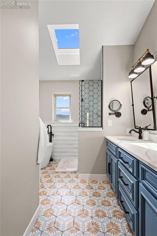 545 Struthers Loop Colorado Springs, CO 80921 - Photo 18 of 48 a bathroom with a sink and mirror