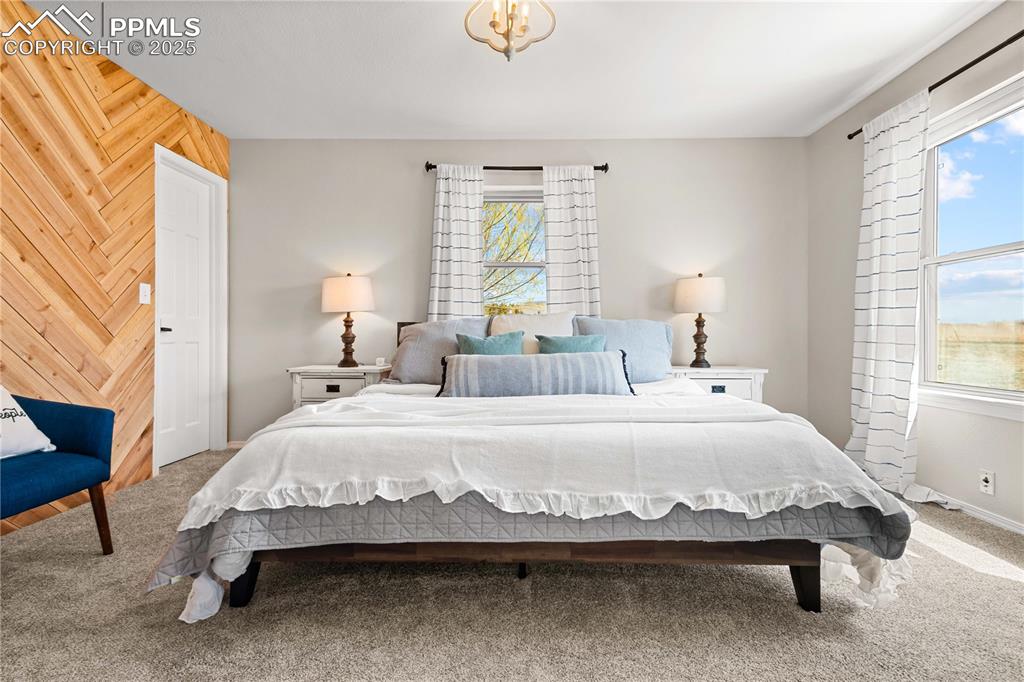 545 Struthers Loop Colorado Springs, CO 80921 - Photo 21 of 48 a bedroom with a bed and a window