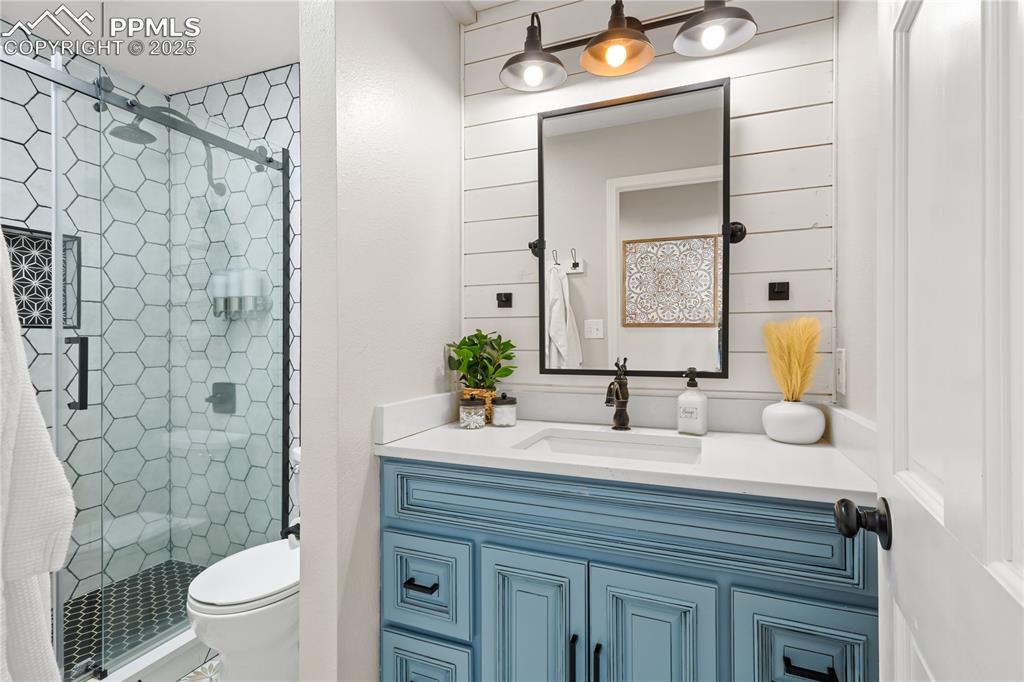 545 Struthers Loop Colorado Springs, CO 80921 - Photo 24 of 48 a bathroom with a sink and a mirror