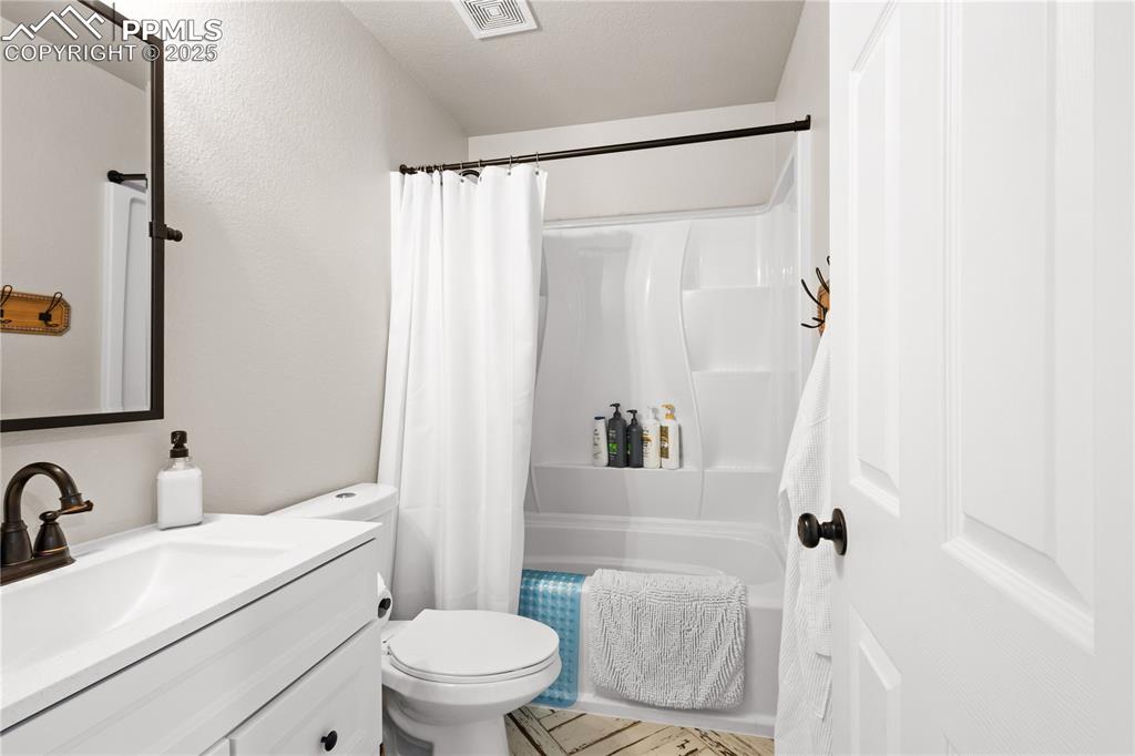 545 Struthers Loop Colorado Springs, CO 80921 - Photo 28 of 48 a bathroom with a sink toilet and shower