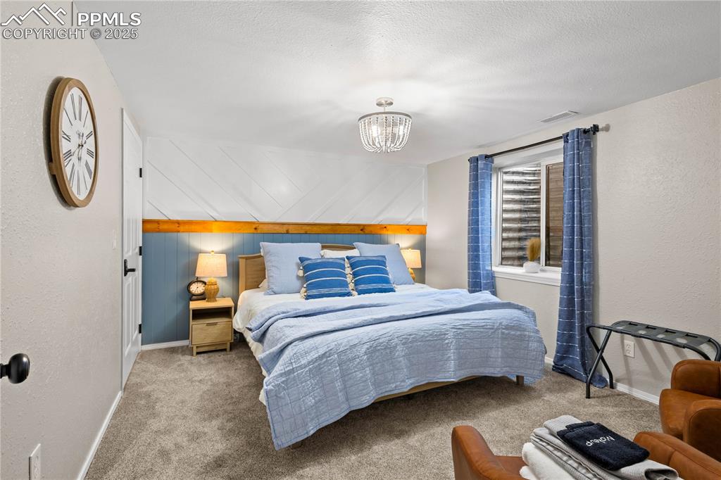 545 Struthers Loop Colorado Springs, CO 80921 - Photo 33 of 48 a bedroom with a bed and a window