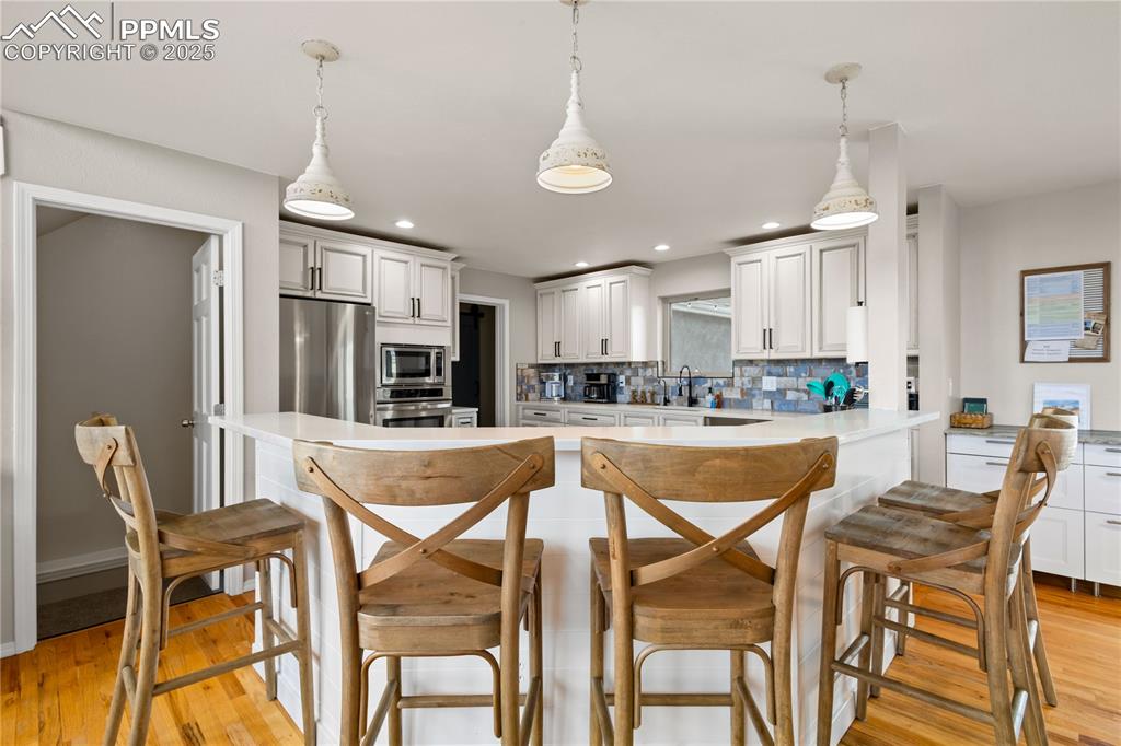 545 Struthers Loop Colorado Springs, CO 80921 - Photo 9 of 48 a view of a dining room with furniture and a table