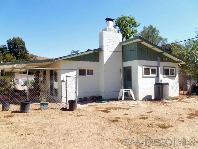 9236 Los Coches Road Lakeside, CA 92040 - Photo 16 of 27 a front view of a house with a yard
