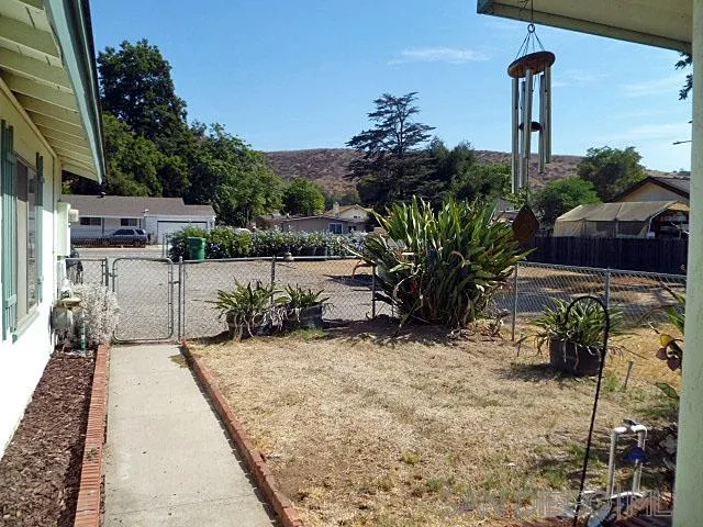 9236 Los Coches Road Lakeside, CA 92040 - Photo 5 of 27 a view of a patio with table and chairs potted plants