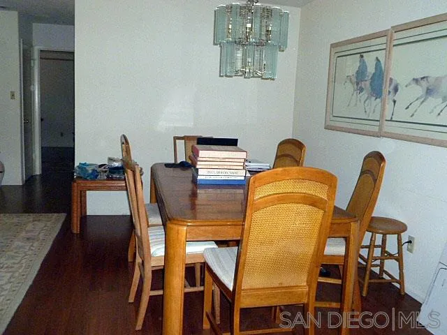 9236 Los Coches Road Lakeside, CA 92040 - Photo 10 of 27 a dining room with furniture and wooden floor