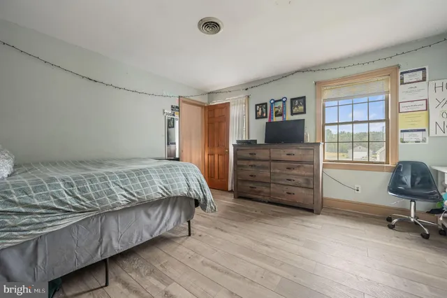 a bedroom with a bed and furniture