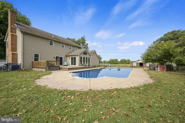 a view of swimming pool with a yard
