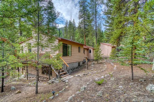 a view of a balcony with wooden fence