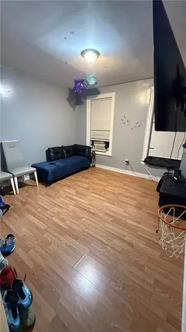 a room with furniture and a flat screen tv