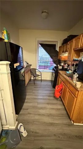 a living room with furniture a rug and a flat screen tv