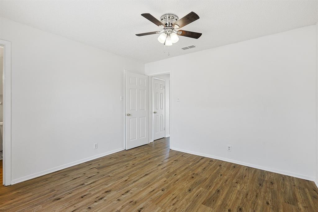 2637 West Randol Mill Road, Unit A Arlington, TX 76012 - Photo 6 of 13 a view of an empty room with wooden floor