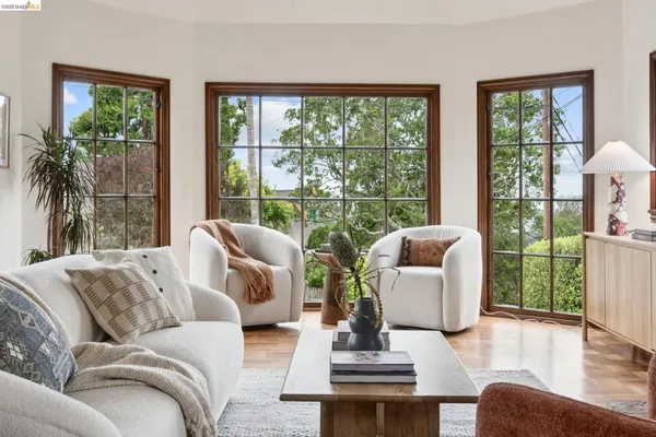 a living room with a large window and a couch