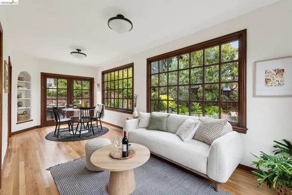 a large kitchen with stainless steel appliances granite countertop a lot of counter space and a wooden floors
