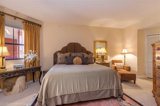 a spacious bedroom with a bed and a couch