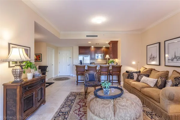 a dining room with furniture and a window