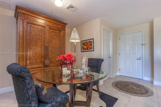 a kitchen with refrigerator and cabinets