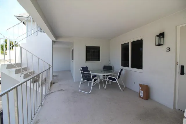 a view of a livingroom with furniture and a window