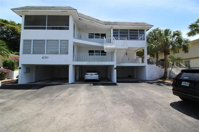 a big room with windows and a fireplace