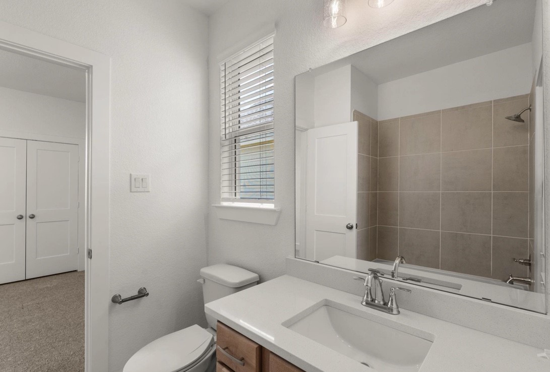 5234 Capricorn Way Manvel, TX 77578 - Photo 18 of 25 a bathroom with a sink toilet and shower