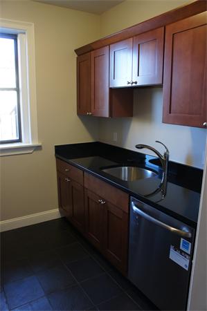 50 Charlesgate East, Unit 192 Boston, MA 02215 - Photo 1 of 1 a kitchen with granite countertop a sink a stove and cabinets