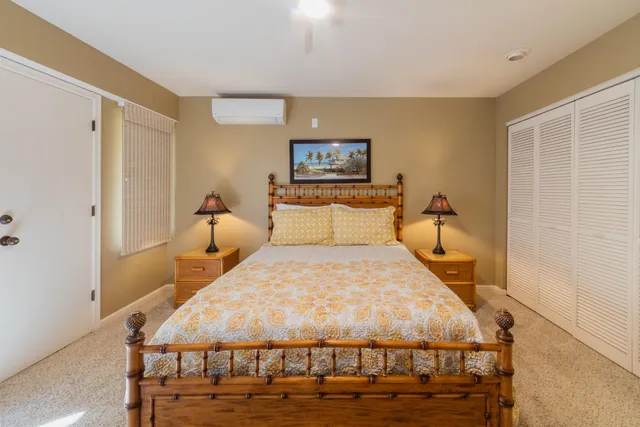 a bedroom with a bed and a table