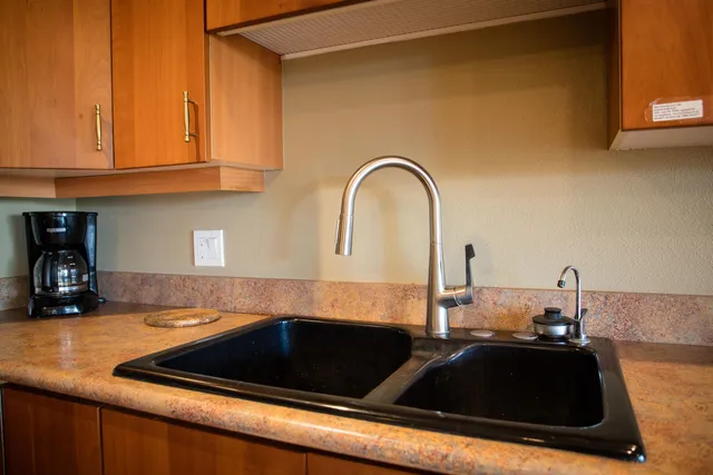 a kitchen with a sink and cabinets