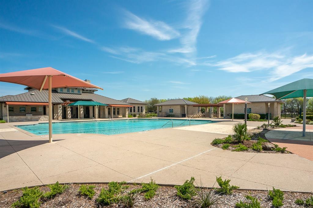 426 Plains Place Fate, TX 75087 - Photo 6 of 24 a view of swimming pool in front of residential houses