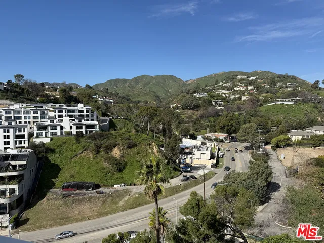 a view of a house with a mountain and a mountain view