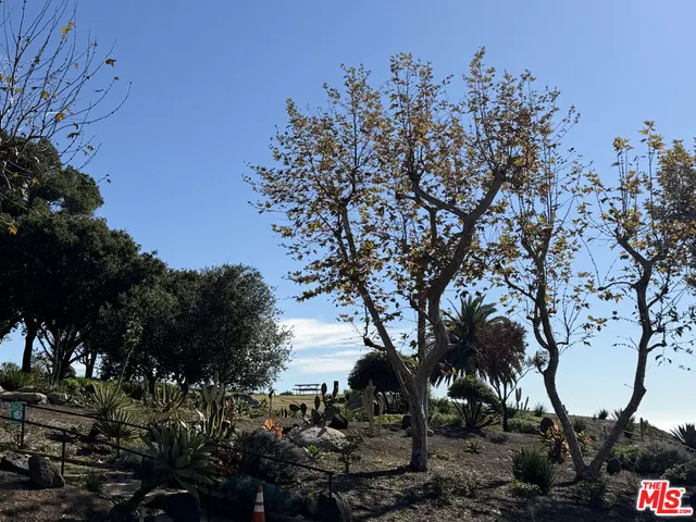 a view of a brick house with a large windows