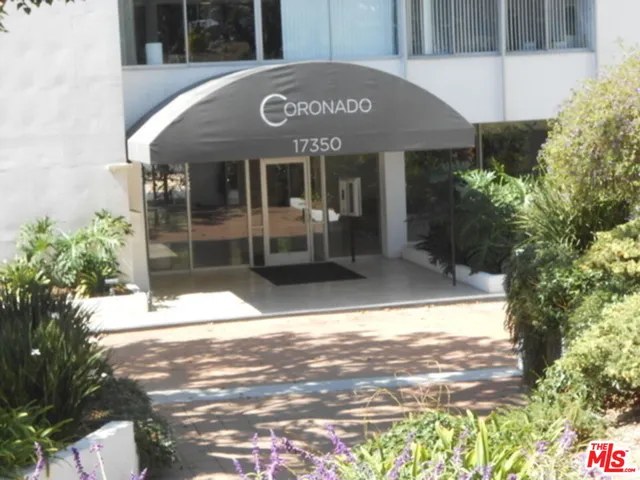 a front view of a building with street view