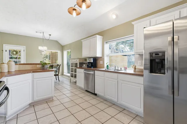 a bedroom with a large bed and a large window